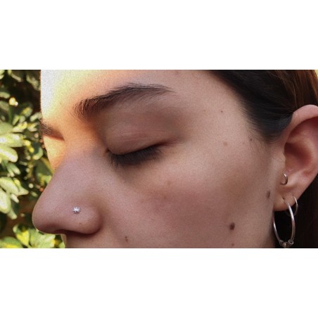 Piercing punto sol