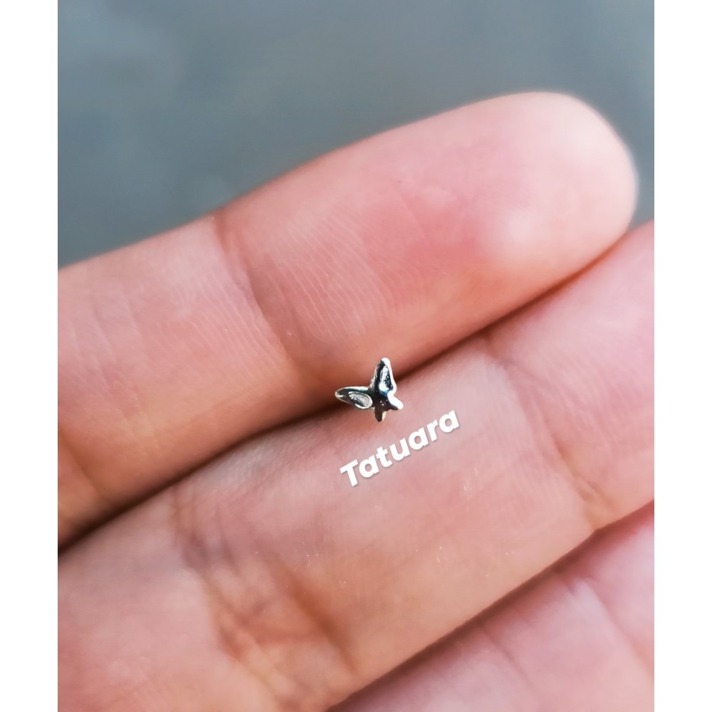 Piercing punto mariposa